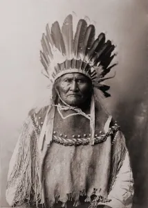 Warriors Prints: Geronimo (1829-1909), Chiricahua Apache warrior in Indian clothing and feathered headdress
