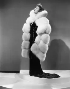 Travis Banton Prints: THE GILDED LILY, Claudette Colbert, in a gown by Travis Banton, 1935