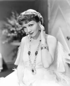 Pendant Prints: THE GILDED LILY, Claudette Colbert wearing jewelry designed by William Howard Hoeffer of Trabert & Hoeffer