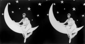 Prop Prints: The Girl in the Moon, stereo view of a scantily clad woman sitting in a crescent moon