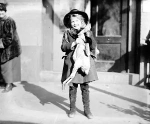 Holiday Prints: Girl with Thanksgiving turkey, 1919