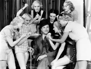 Popular Prints: GOLD DIGGERS OF 1933, Dick Powell, surrounded by Busby Berkeley chorines, 1933