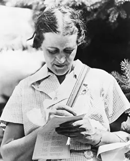 Winner Prints: Golfer Opal Hill checking her score of 75 that gave her the medal in the opening round