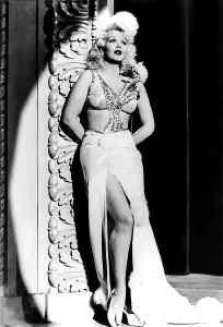 Slit Skirt Prints: THEY GOT ME COVERED, Marion Martin, 1943