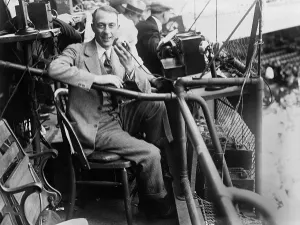 Graham Prints: Graham McNamee (1888-1942), in his box at Griffith Stadium