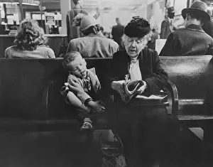 Magazine Prints: Grandmother with her young companion in the waiting room of the Greyhound Bus Station
