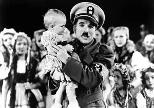 Hold In Arms Prints: THE GREAT DICTATOR, right: Charlie Chaplin, 1940