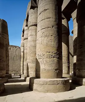 Great Temple of Amon-Re. 16th-4th c. BC. EGYPT. Karnak. Thebes. Temple of Amon - Ra. Hypostyle Hall. Columns decorated with reliefs carried out in times of Seti I and Ramses II
