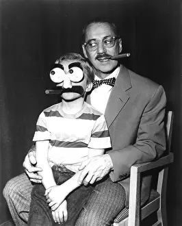 Sitting On Lap Prints: Groucho Marx and a child with a Groucho mask