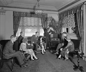 Cabinet Prints: Group of men and women listening to a radio in the Hamilton Hotel