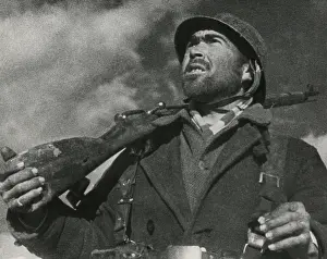 Guarding Prints: On the Guadalajara front, a soldier looks out for airplanes