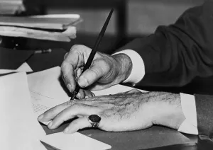 Law Making Prints: Hands of Franklin D. Roosevelt signing a document in the First 100 Days of the New Deal