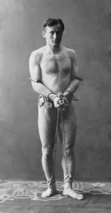 Chains Prints: Harry Houdini (1874-1926), in chains. Ca. 1900