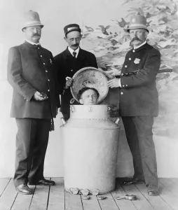 Underwater Prints: Harry Houdini performs the great milk can escape from a giant milk can filled with water in St