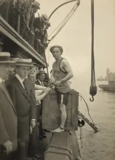 Excitement Prints: Harry Houdini stepping into a crate to be lowered into New York Harbor on July 7, 1912