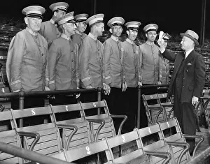 Bleachers Prints: Head usher giving instructions to his staff before the start of the World Series