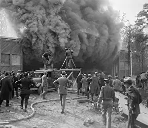 Filming Prints: Hearst Movietone cameramen film a fire in Washington