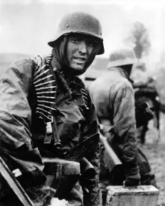 Ammunition Prints: Heavily armed German soldiers advancing in Belgium through thin American lines