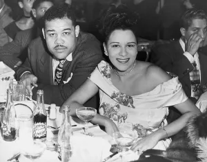 Heavyweights Prints: Heavyweight champ Joe Louis and his first wife Marva dining at a night club in 1947