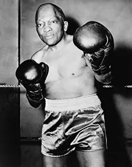 Bare Chested Prints: Former Heavyweight champion Jack Johnson in boxing pose. Ca. 1930s. - (BSLOC_2014_17_144)