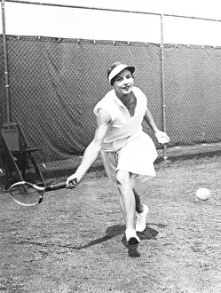 Tennis Prints: Helen Wills Moody in Doubles action at the U