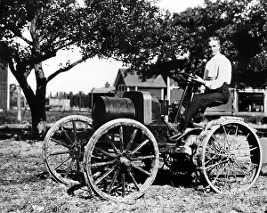 Images Dated 20th March 2007: Henry Ford at the controls of one of his first tractors powered by a 1904 Model-B type engine