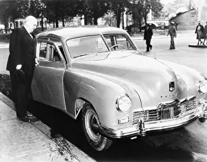 Industrialists Prints: Henry Kaiser opens the door of the first Kaiser Special to come off assembly-line
