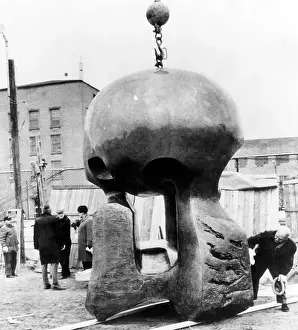 Sculptor Prints: Henry Moore (far right), examining his work Nuclear Energy