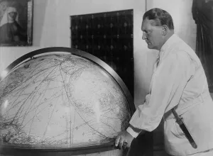 Globe Prints: Hermann Goering, leaning toward a large globe in 1939
