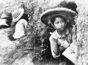 Digging Prints: High school girls digging air raid shelters in a hillside in Hanoi