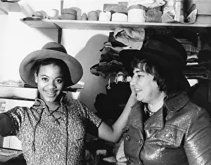Abzug Prints: A high school student tries on one of Bella Abzug's wide brimmed campaign hats