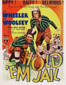 Football Uniform Prints: HOLD EM JAIL, l-r: Bert Wheeler, Robert Woolsey on poster art, 1932