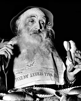 New York City Area Prints: A homeless man, enjoys a free lunch at the Bowery Follies in New York