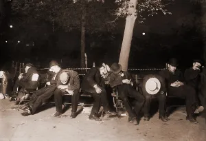 Business Cycles Prints: Homeless men sleeping on a park bench in New York City, 1910