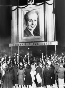 Argentine Prints: Honor Eva Peron. Argentines mourning the death of Eva Peron beneath a huge portrait of the deceased wife of their