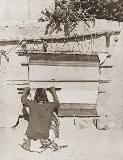 1870s Prints: Hopi man weaving a blanket uses a wooden sley