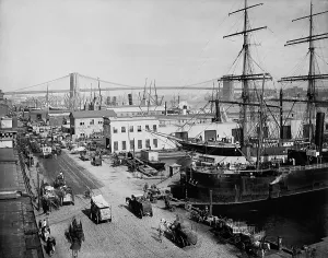 Harbors Prints: Horse-drawn express wagons moored ships and piers at New York City's South Street Seaport New York in 1901