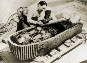 Occupational Prints: Howard Carter (1873-1939), seated beside coffin of King Tutankhamen