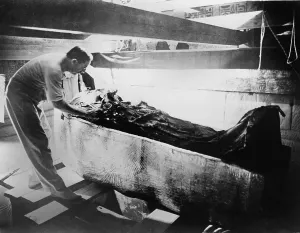 Excavation Prints: Howard Carter (1874-1939), turning back a shroud covering the inner coffin of Tutankhamen