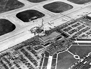 Crowd Prints: Howard Hughes lands at Floyd Bennett Airport in his silver monoplane after completing his record-breaking 91 hour