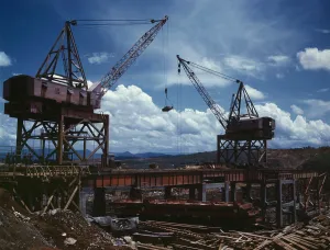 Valley Prints: Huge Cranes lift steel beams during the construction of Tennessee Valley Authority's Douglas Dam