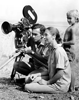 Hugo van Lawick, Jane Goodall, and their son, Grub study the lifestyles of Baboons in Tanzania. ca 1976. Courtesy: CSU Archives/Everett Collection