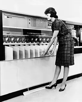 Operators Prints: IBM 1419 magnetic character reader read and sorted checks at up to 1600 per minute