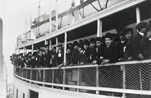 Inspection Prints: Immigrant men on an Ellis Island Ferry, c. 1905