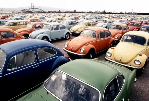 Vehicles Prints: Imported Volkswagen Beetles on an American pier