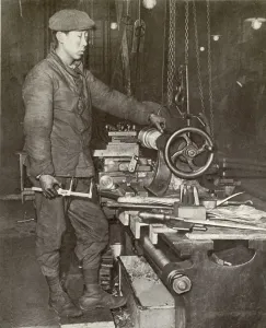 War Workers Prints: Indo-Chinese workman at ammunition factory lathe in France during WW1
