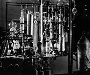 Chemicals Prints: Industrial chemist among glass tubes in a laboratory