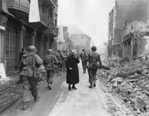War 2 Prints: As infantrymen march through a German town