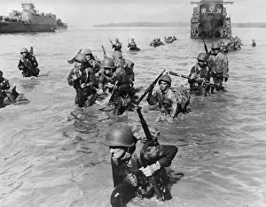 Invasions Prints: Infantrymen wade ashore in neck-deep water from their LCI's to Morotai Island Beach