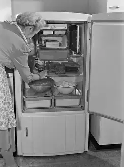 Electricity Prints: Interior of a 1940's refrigerator has a small freezer section